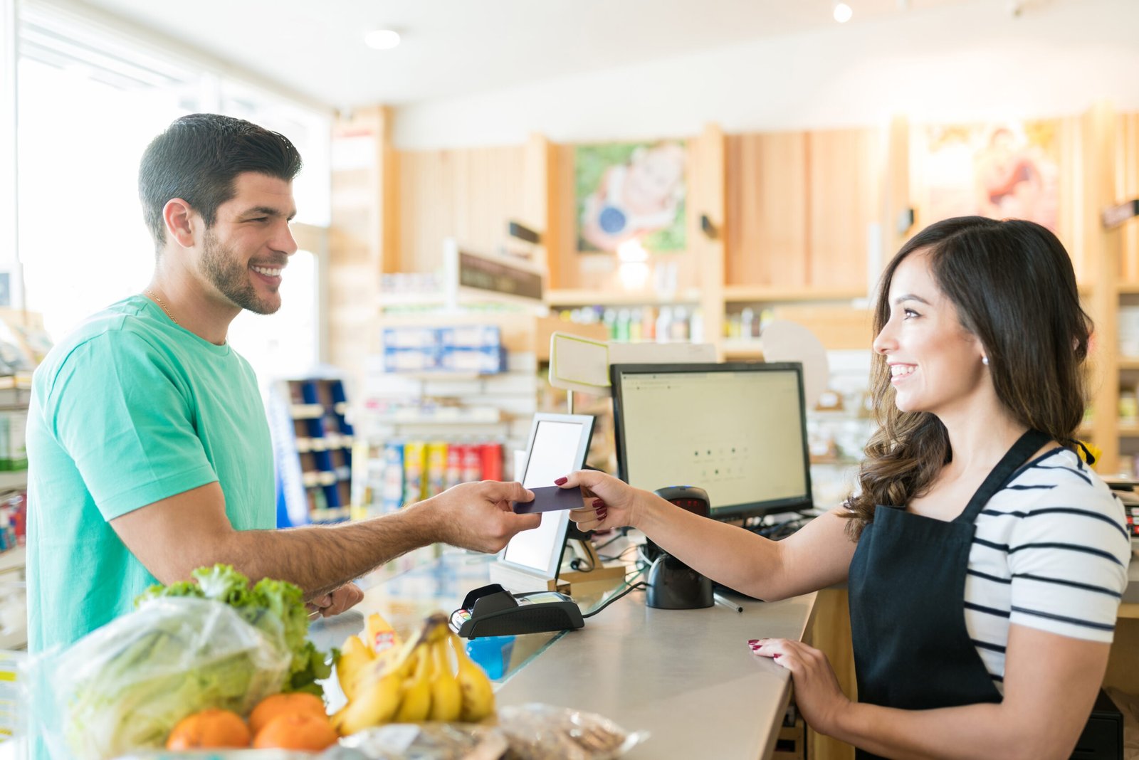 Small business owner processing a customer payment with Business Access USA