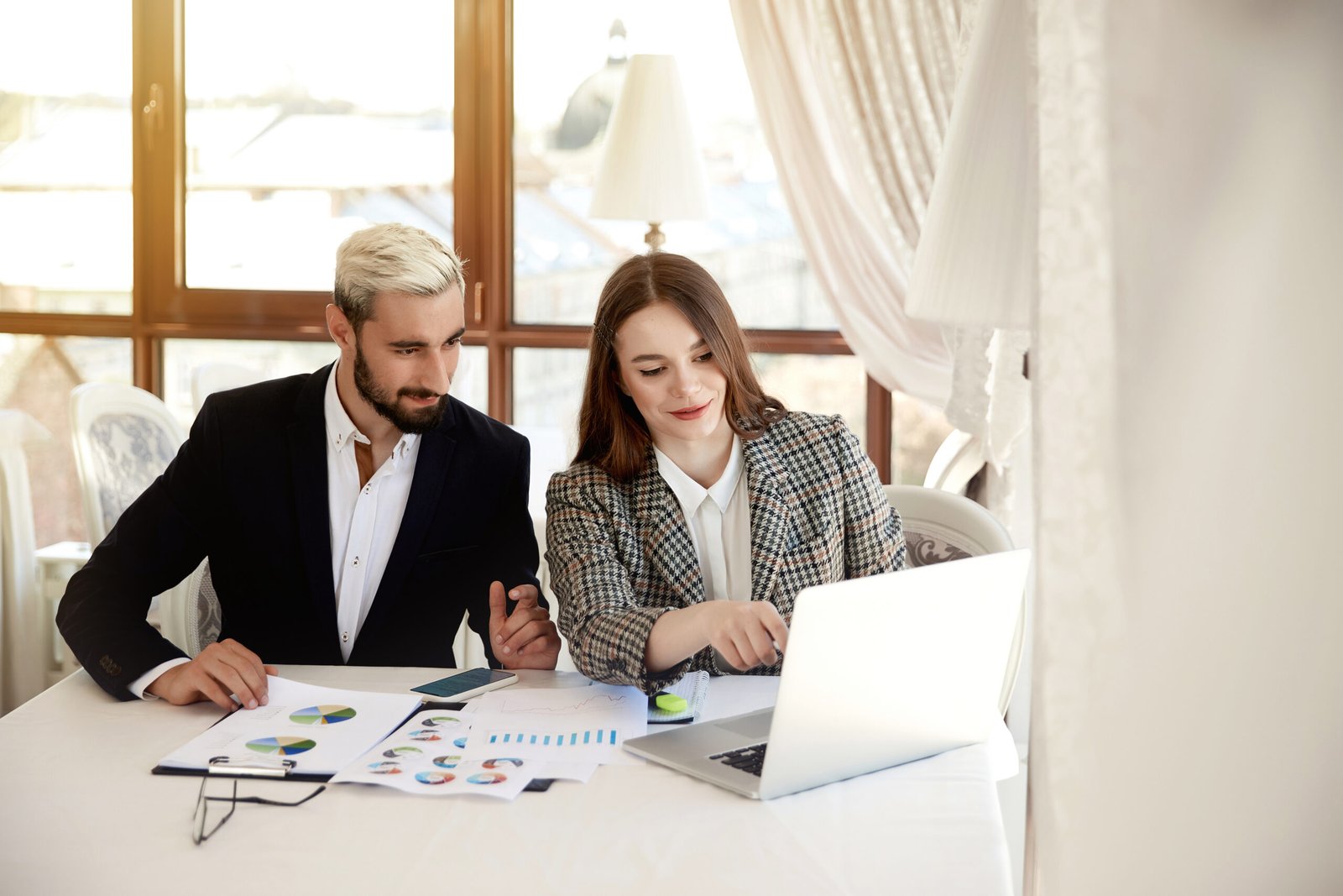 Business owner reviewing cash flow and working capital documents